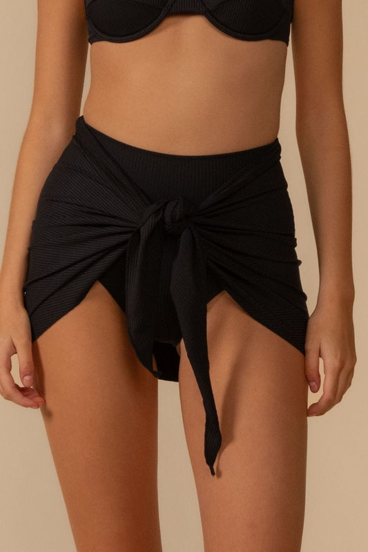 Black Rib Sarong in black ribbed fabric, front view tied at the waist