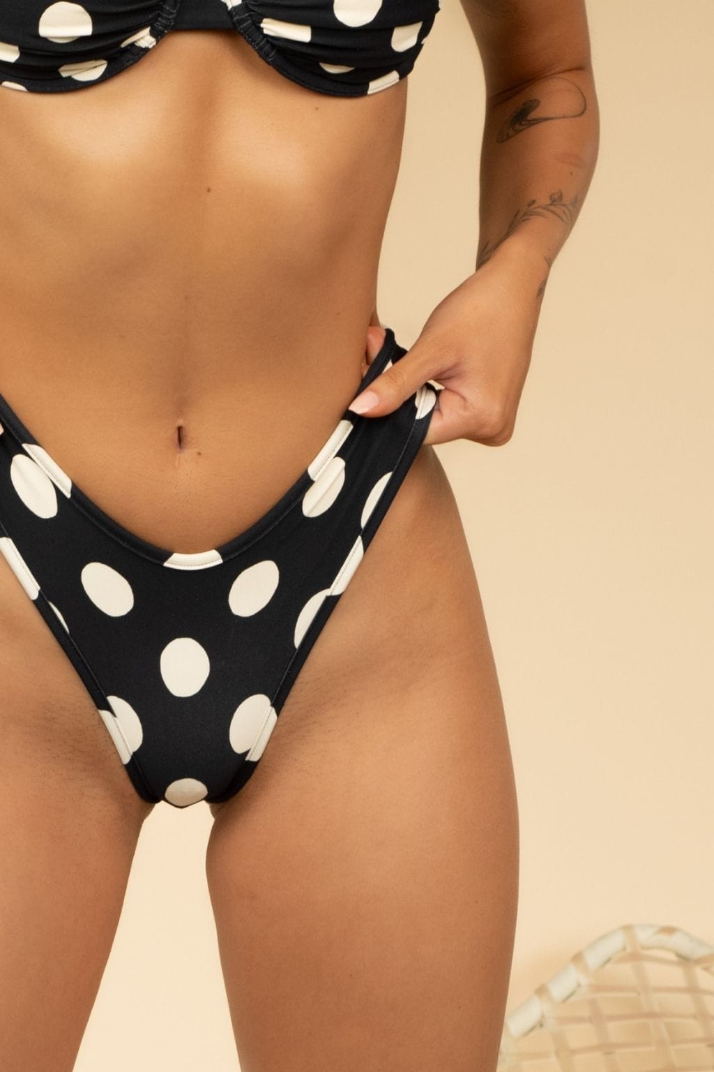 Polka Dot Lulu Bikini Bottom in black with white polka dots, front view