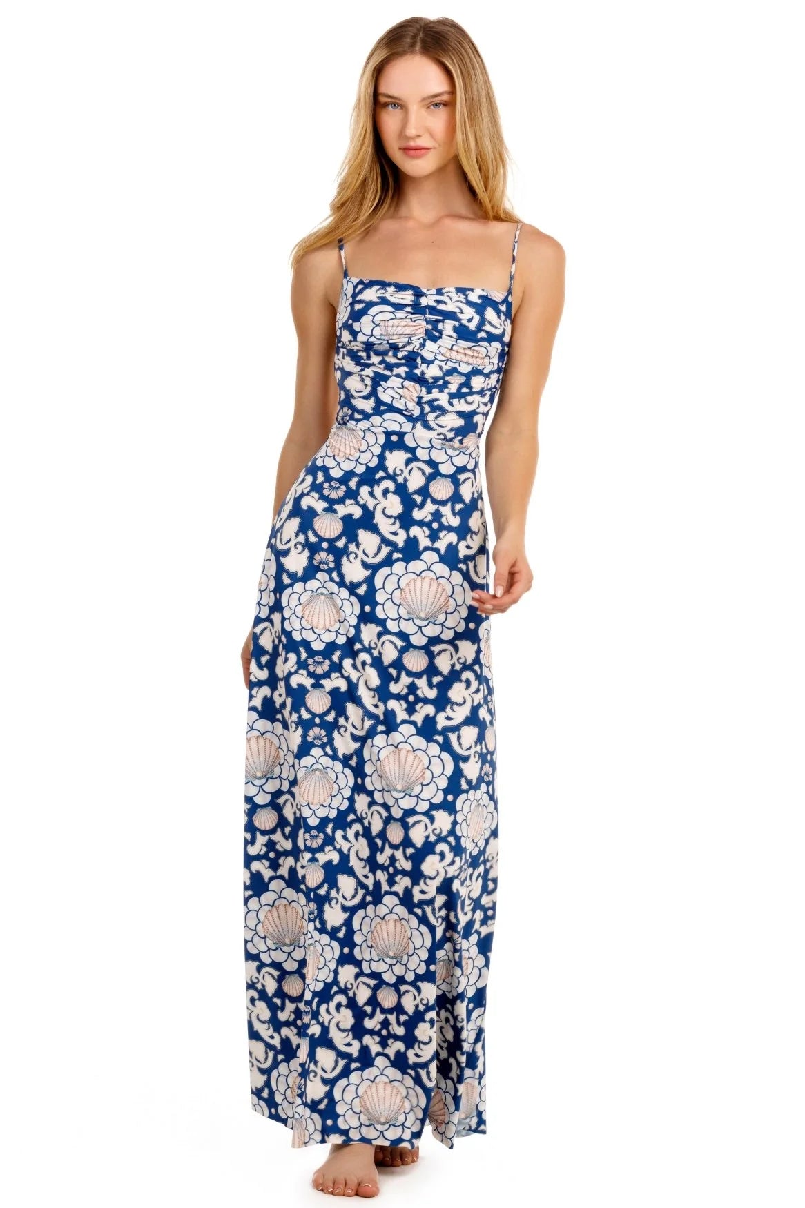 Woman wearing a blue floral dress on a white background