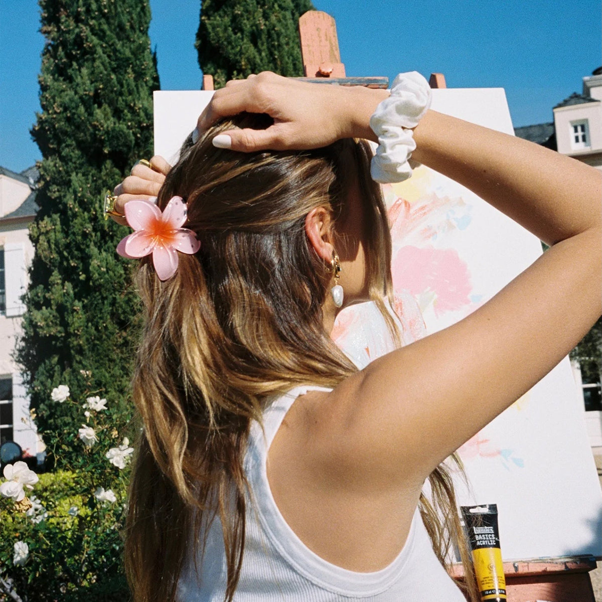 Super Bloom Clip in Guava worn in the hair